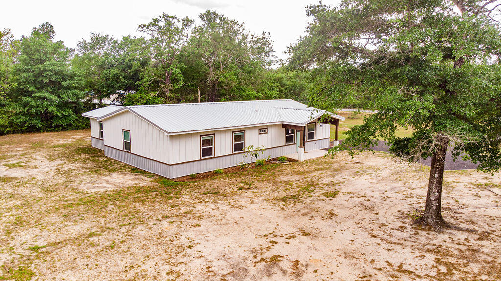 5742 Mt Olive Road Crestview, FL 32539 - Photo 56 of 59 a house with trees in front of it