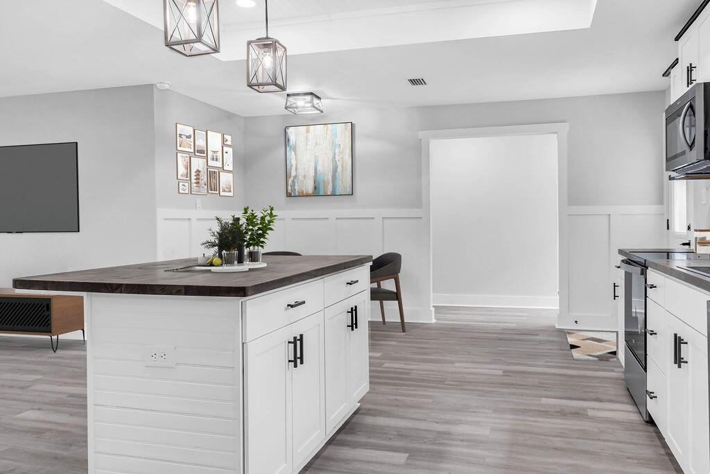 5742 Mt Olive Road Crestview, FL 32539 - Photo 6 of 59 a kitchen with stainless steel appliances granite countertop a sink and stove