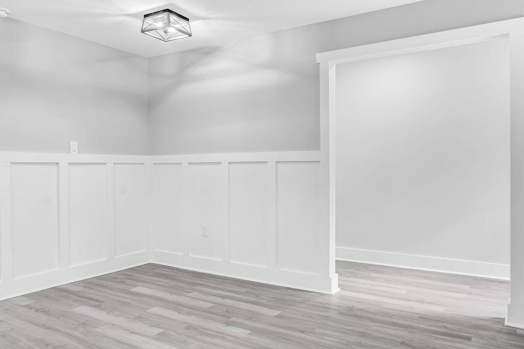 5742 Mt Olive Road Crestview, FL 32539 - Photo 9 of 59 a view of an empty room with wooden floor