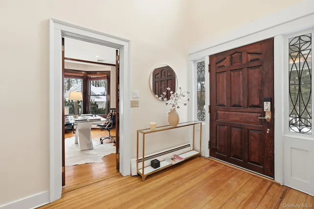 a living room with furniture and view of kitchen
