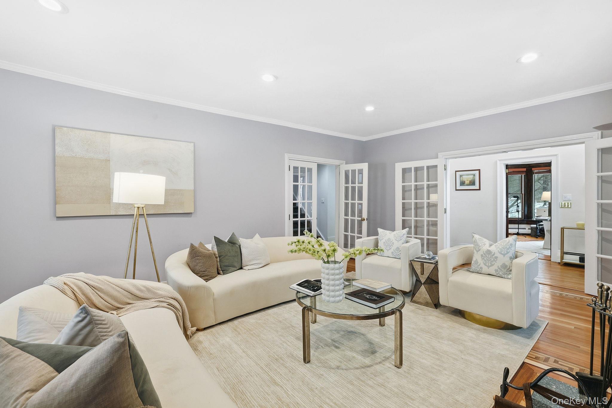 276 Quaker Road Chappaqua, NY 10514 - Photo 21 of 41 a bedroom with furniture and wooden floor