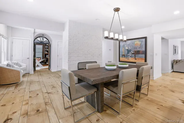 a kitchen with a table and chairs in it