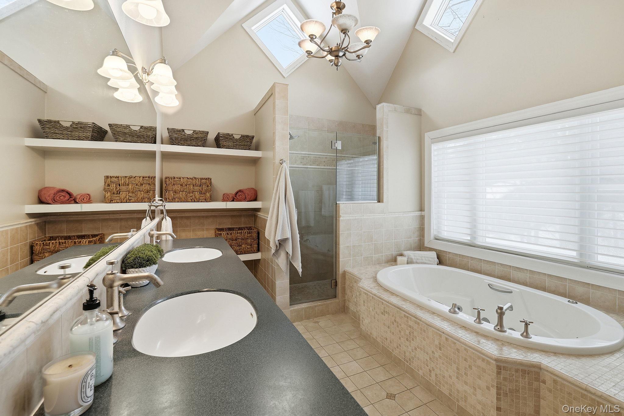 276 Quaker Road Chappaqua, NY 10514 - Photo 29 of 41 a bathroom with a granite countertop sink and a mirror