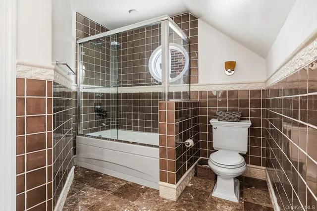 a bedroom with bed and a window