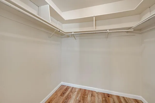 a bathroom with a granite countertop sink mirror and toilet