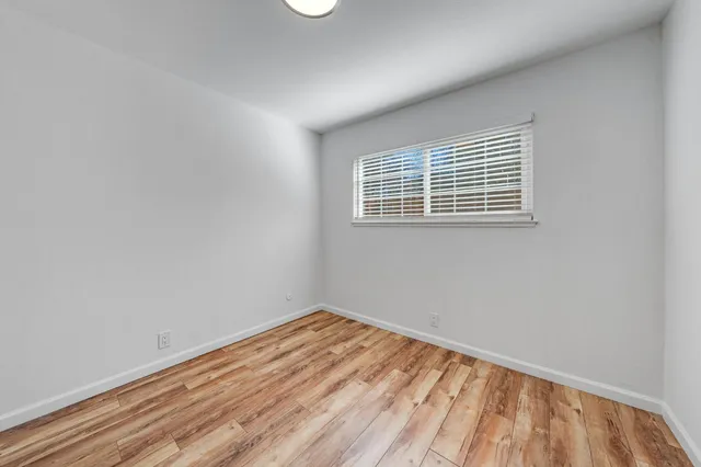 a bathroom with a granite countertop toilet a sink and a bathtub