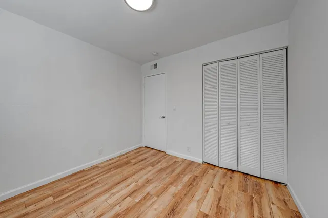 a bathroom with a granite countertop toilet a sink and bathtub