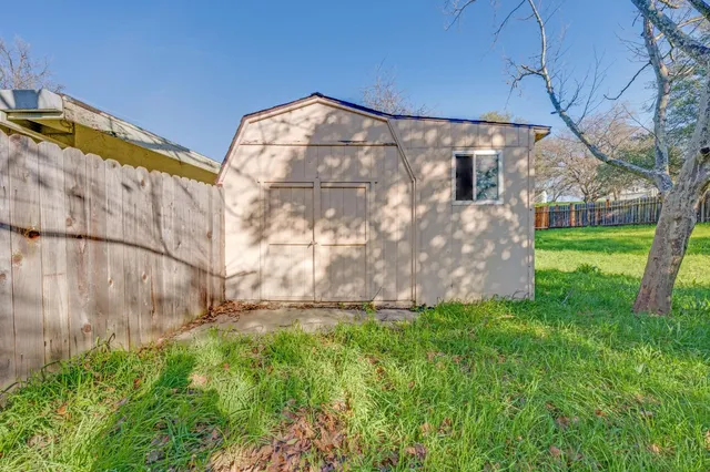 a bedroom with a bed and a dresser in it