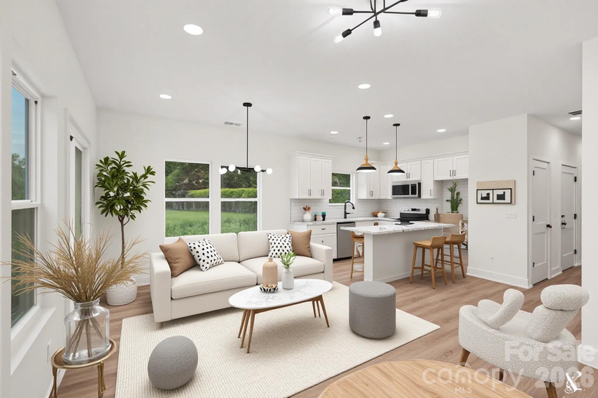7521 Lawyers Road Charlotte, NC 28227 - Photo 3 of 35 a living room with furniture and a large window