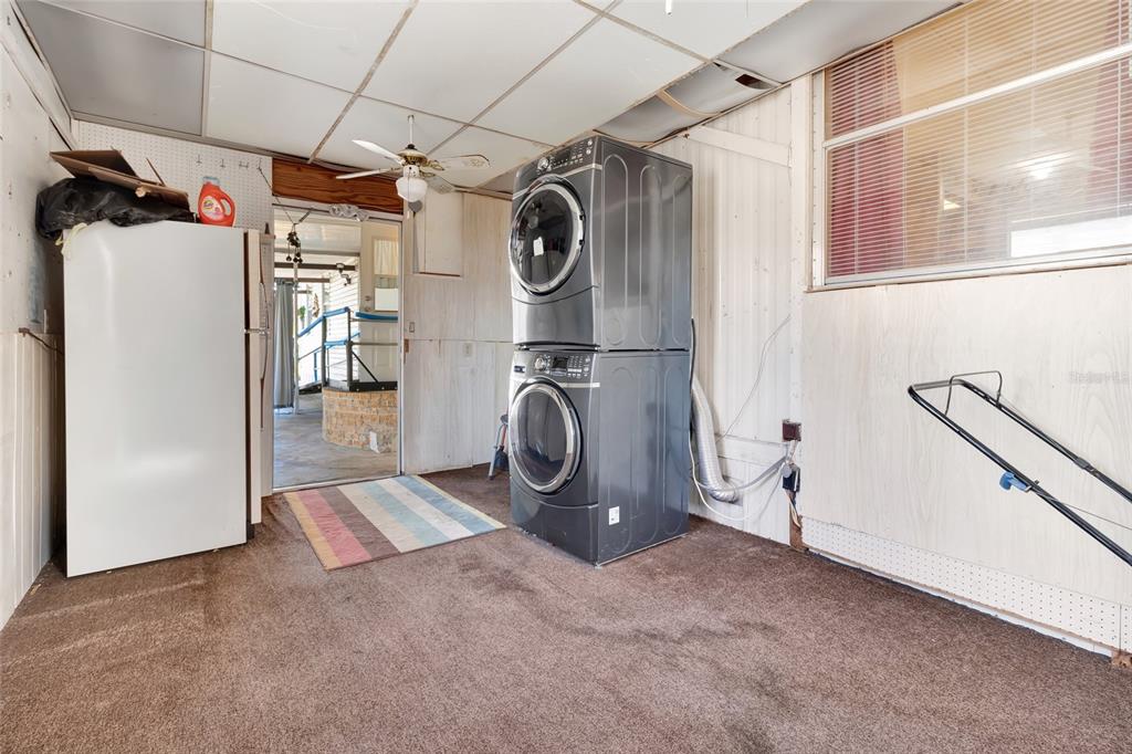 1409 Ridge Road Tavares, FL 32778 - Photo 30 of 36 a utility room with dryer and washer