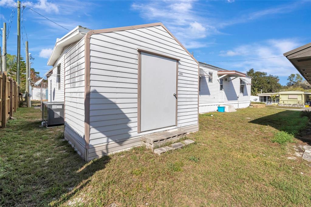 1409 Ridge Road Tavares, FL 32778 - Photo 33 of 36 a view of a house with backyard and sitting area