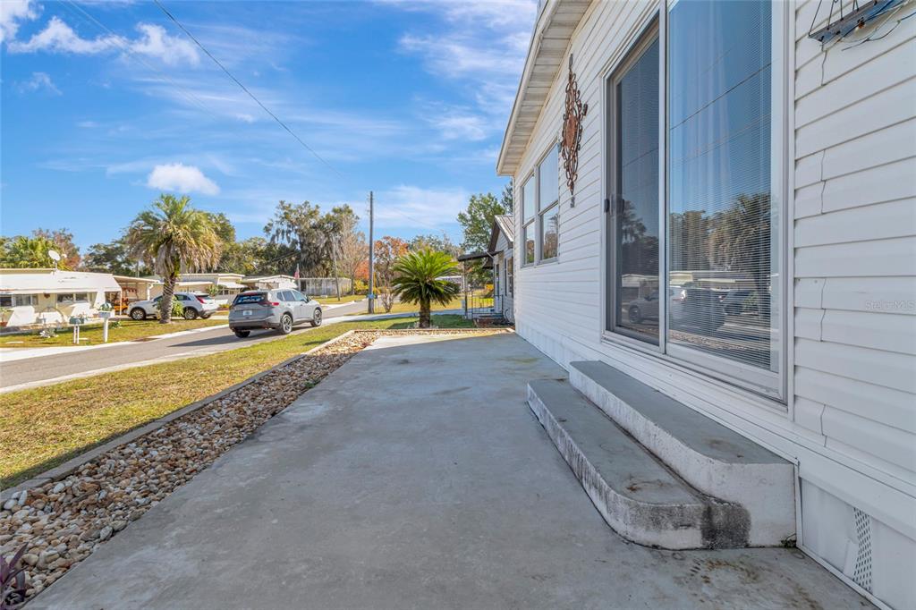 1409 Ridge Road Tavares, FL 32778 - Photo 5 of 36 a view of a street with cars on road