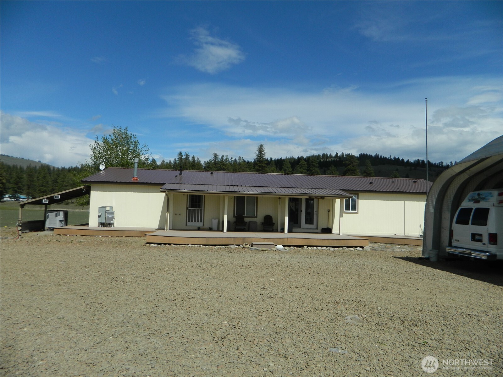 29 Duck Flats Road Tonasket, WA 98855 - Photo 4 of 25 front view of house with a street view