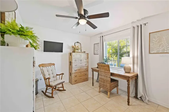 a work room with furniture and a window