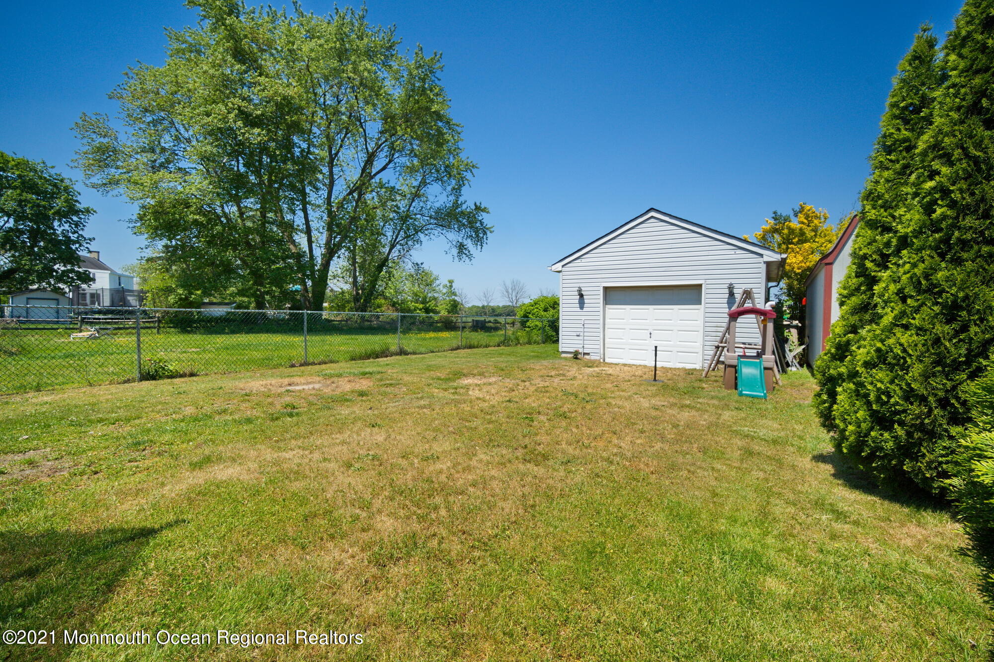 2477 Monmouth Road Jobstown, NJ 08041 - Photo 19 of 37 a front view of a house with a yard and garage
