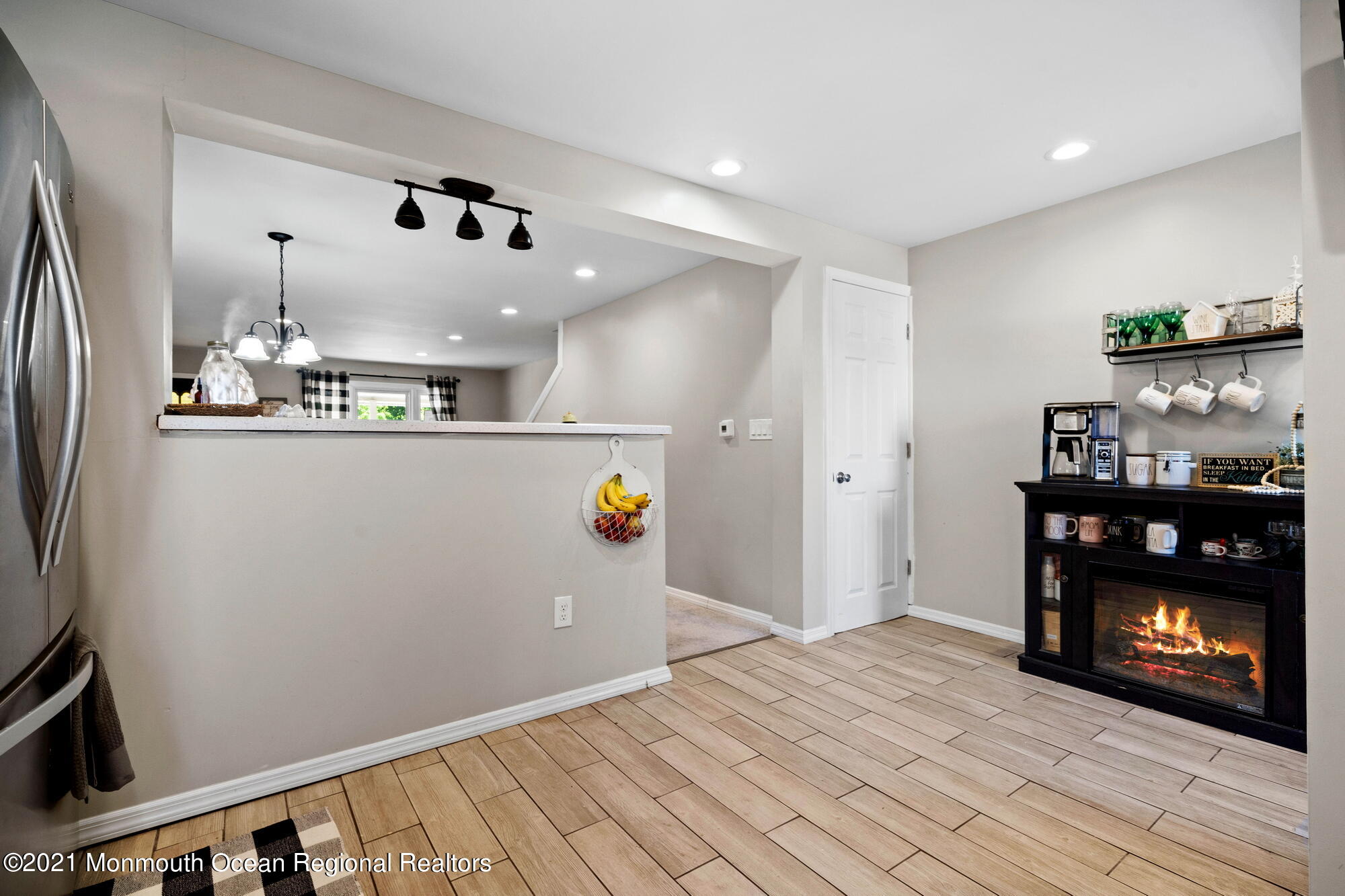 2477 Monmouth Road Jobstown, NJ 08041 - Photo 31 of 37 a kitchen with stainless steel appliances a refrigerator and a fireplace