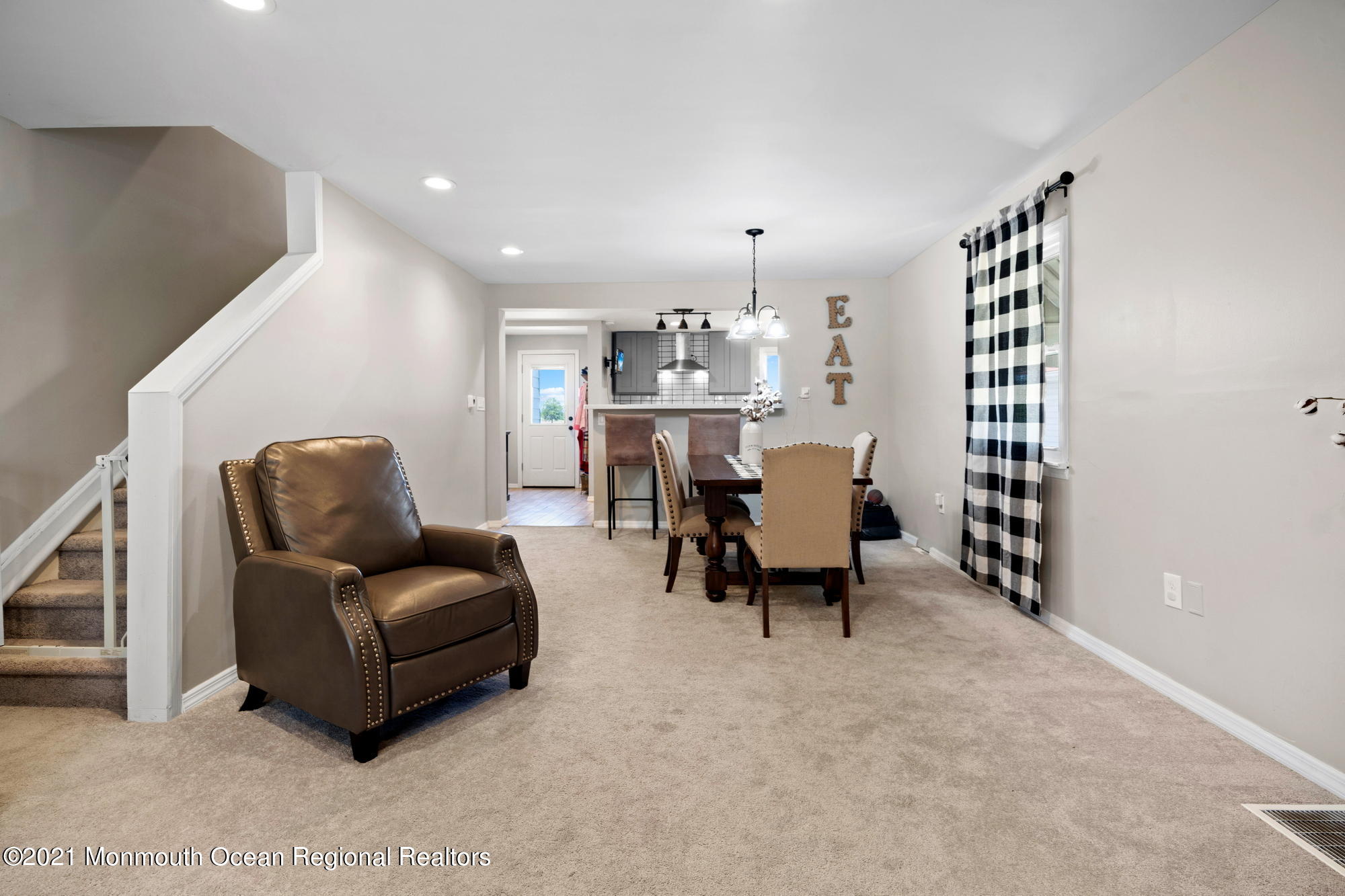 2477 Monmouth Road Jobstown, NJ 08041 - Photo 10 of 37 a living room with furniture and a chandelier