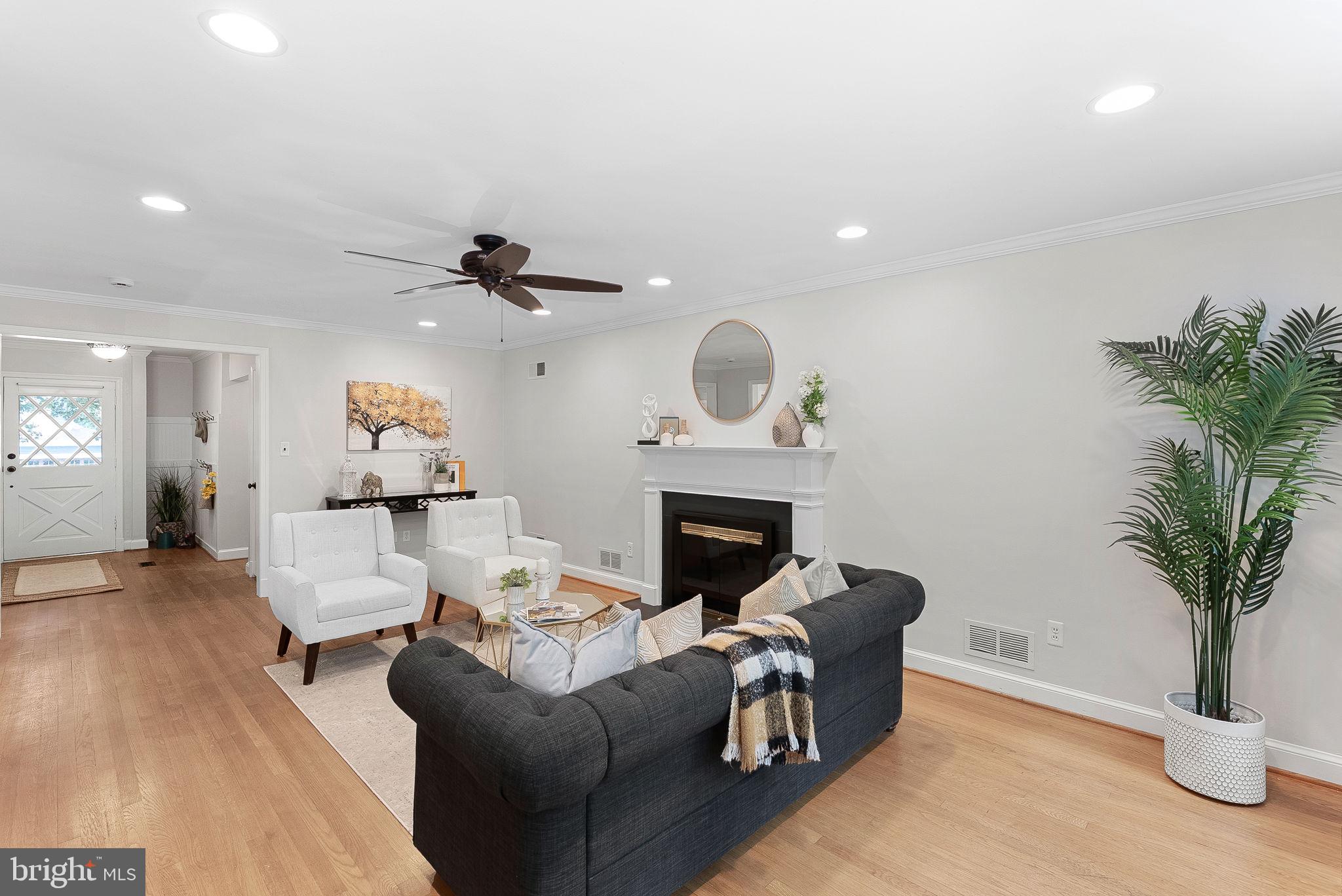 8707 Ridge Road Bethesda, MD 20817 - Photo 11 of 70 a living room with furniture and a fireplace
