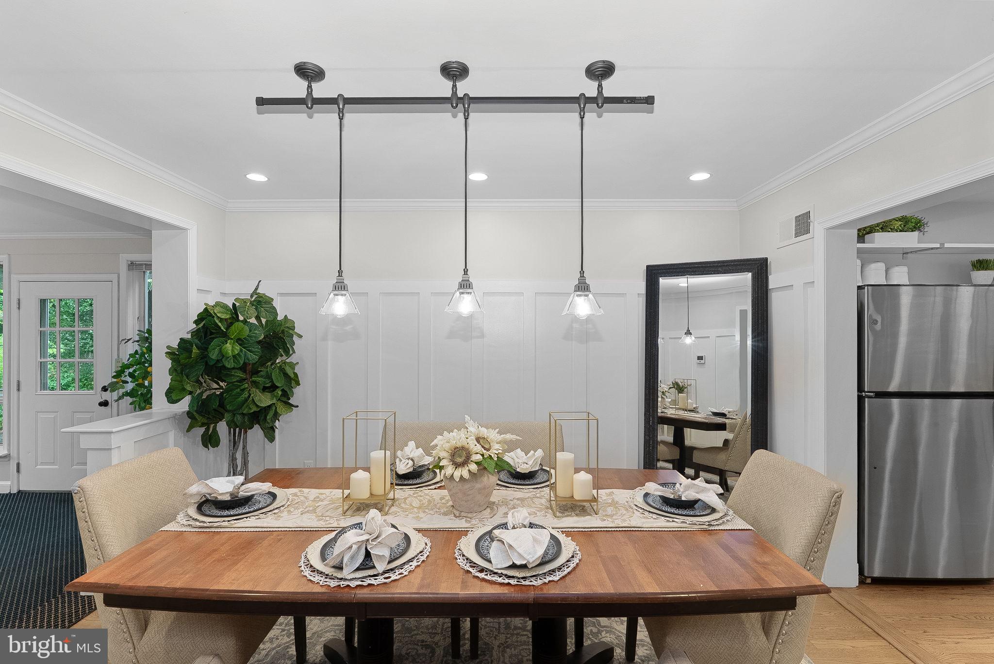 8707 Ridge Road Bethesda, MD 20817 - Photo 13 of 70 a view of a dining room with furniture and wooden floor