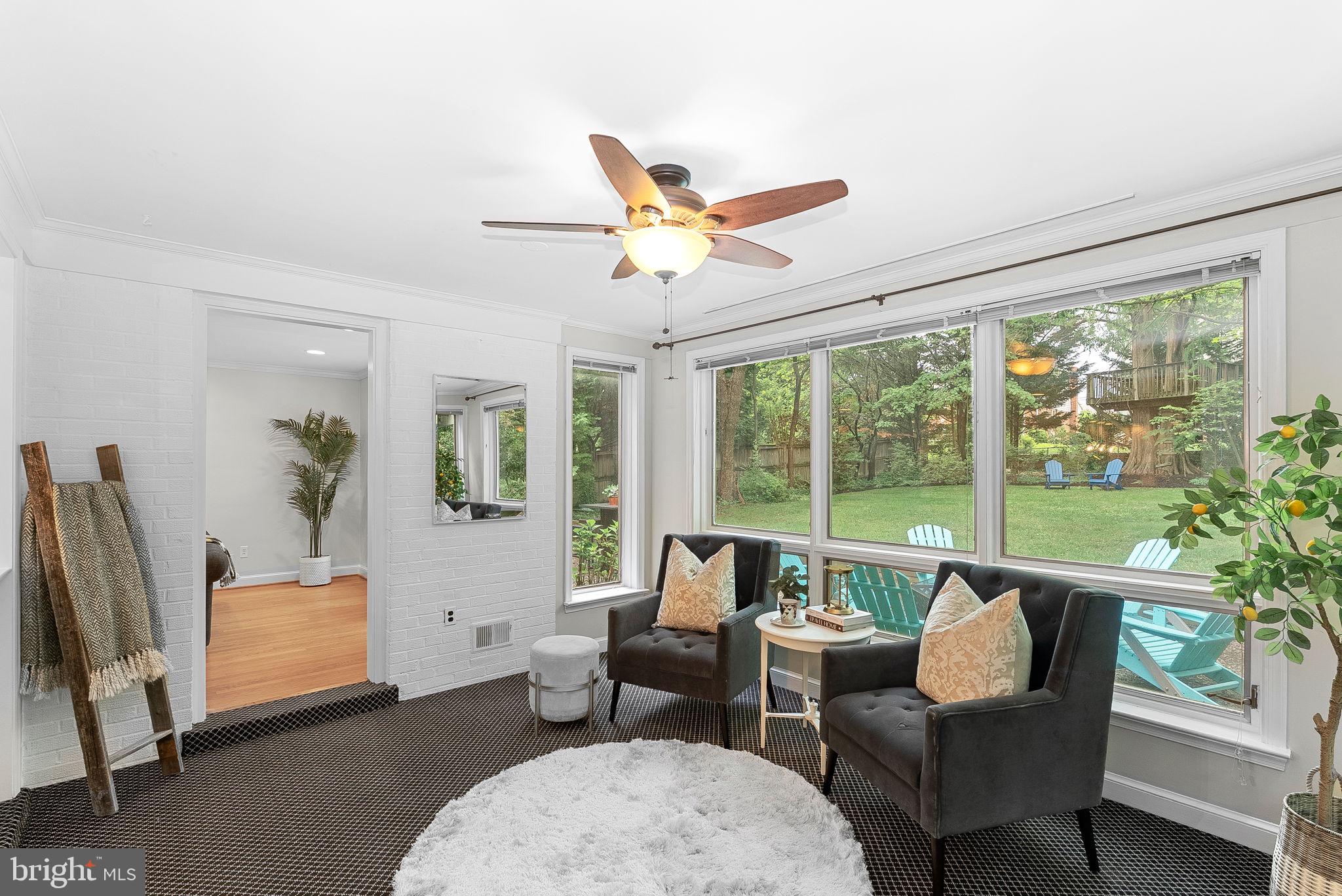 8707 Ridge Road Bethesda, MD 20817 - Photo 15 of 70 a living room with furniture and a floor to ceiling window