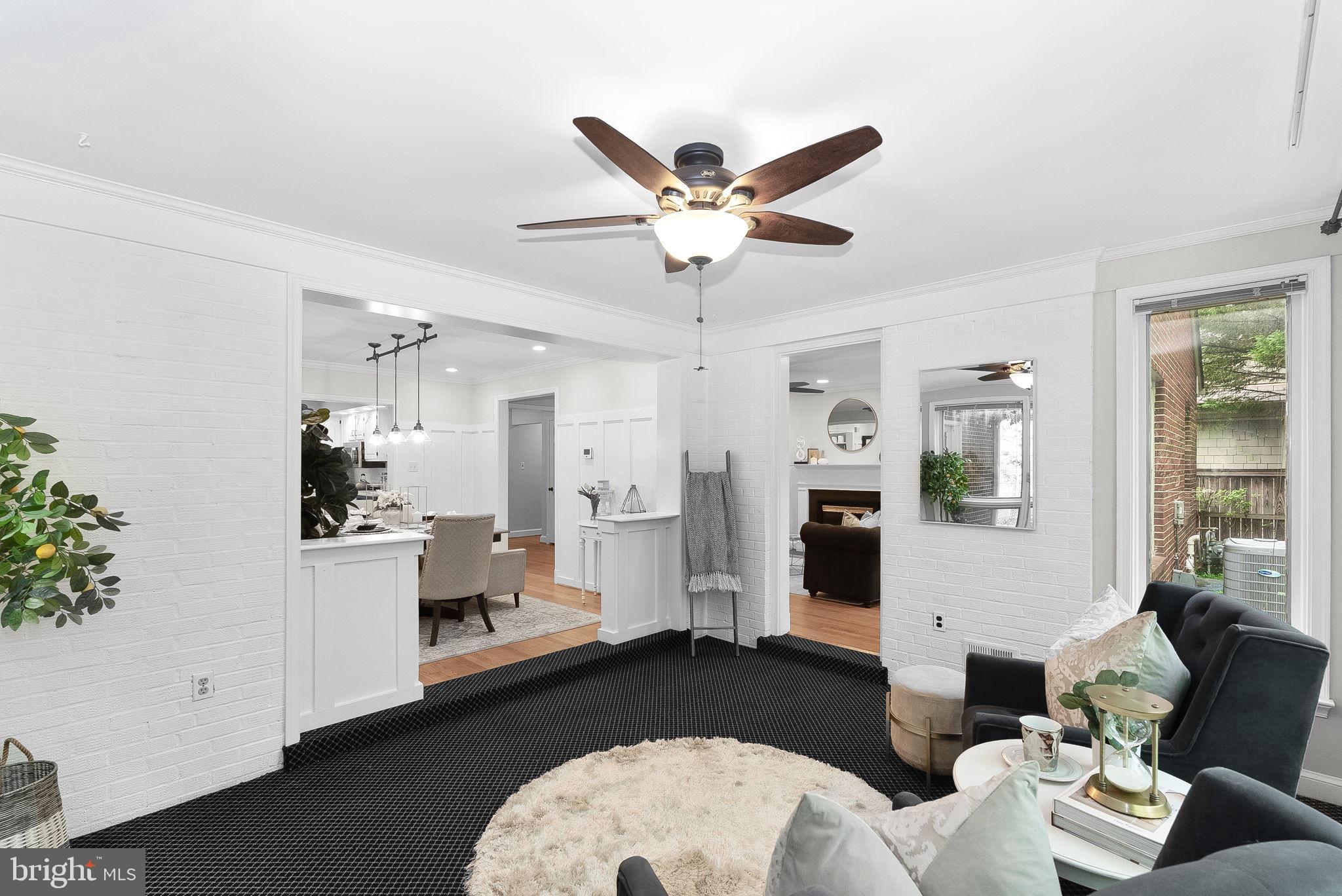 8707 Ridge Road Bethesda, MD 20817 - Photo 20 of 70 a living room with furniture and a chandelier