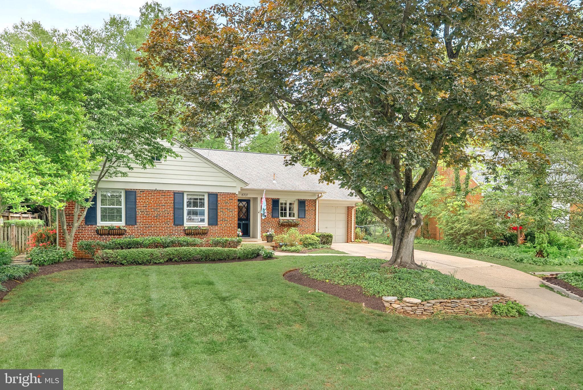 8707 Ridge Road Bethesda, MD 20817 - Photo 3 of 70 a front view of a house with a garden