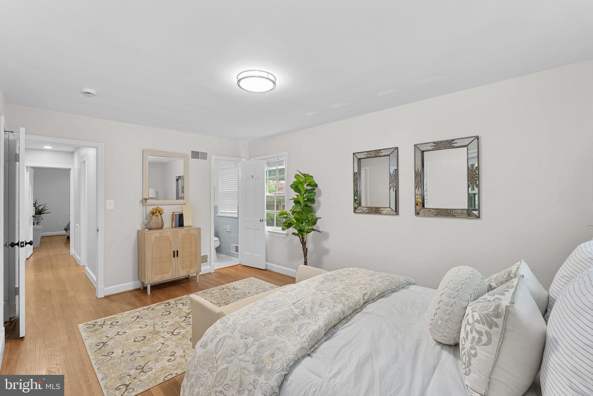 8707 Ridge Road Bethesda, MD 20817 - Photo 31 of 70 a bedroom with a bed and a couch