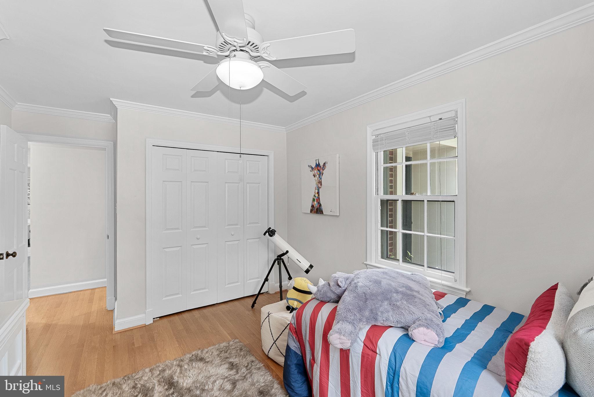 8707 Ridge Road Bethesda, MD 20817 - Photo 38 of 70 a bed room with a bed and a chandelier