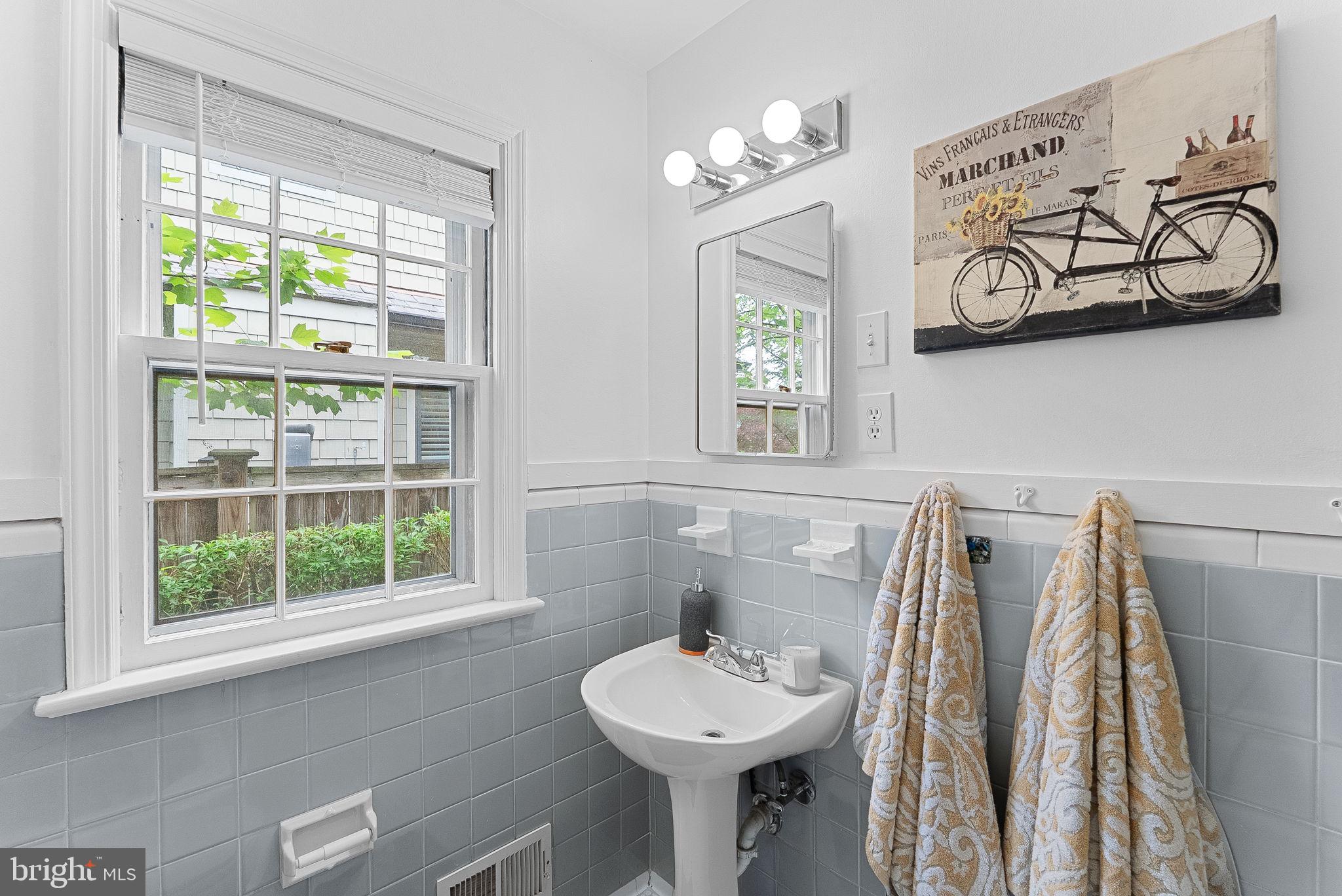 8707 Ridge Road Bethesda, MD 20817 - Photo 54 of 70 a bathroom with a sink and a mirror