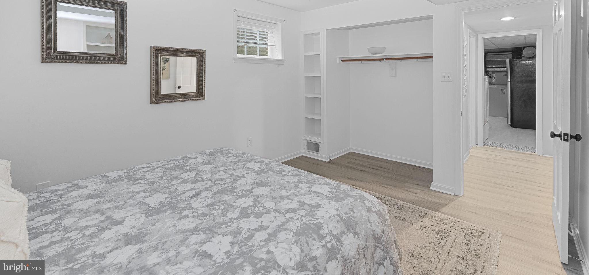 8707 Ridge Road Bethesda, MD 20817 - Photo 61 of 70 a view of a bedroom with wooden floor and bathroom