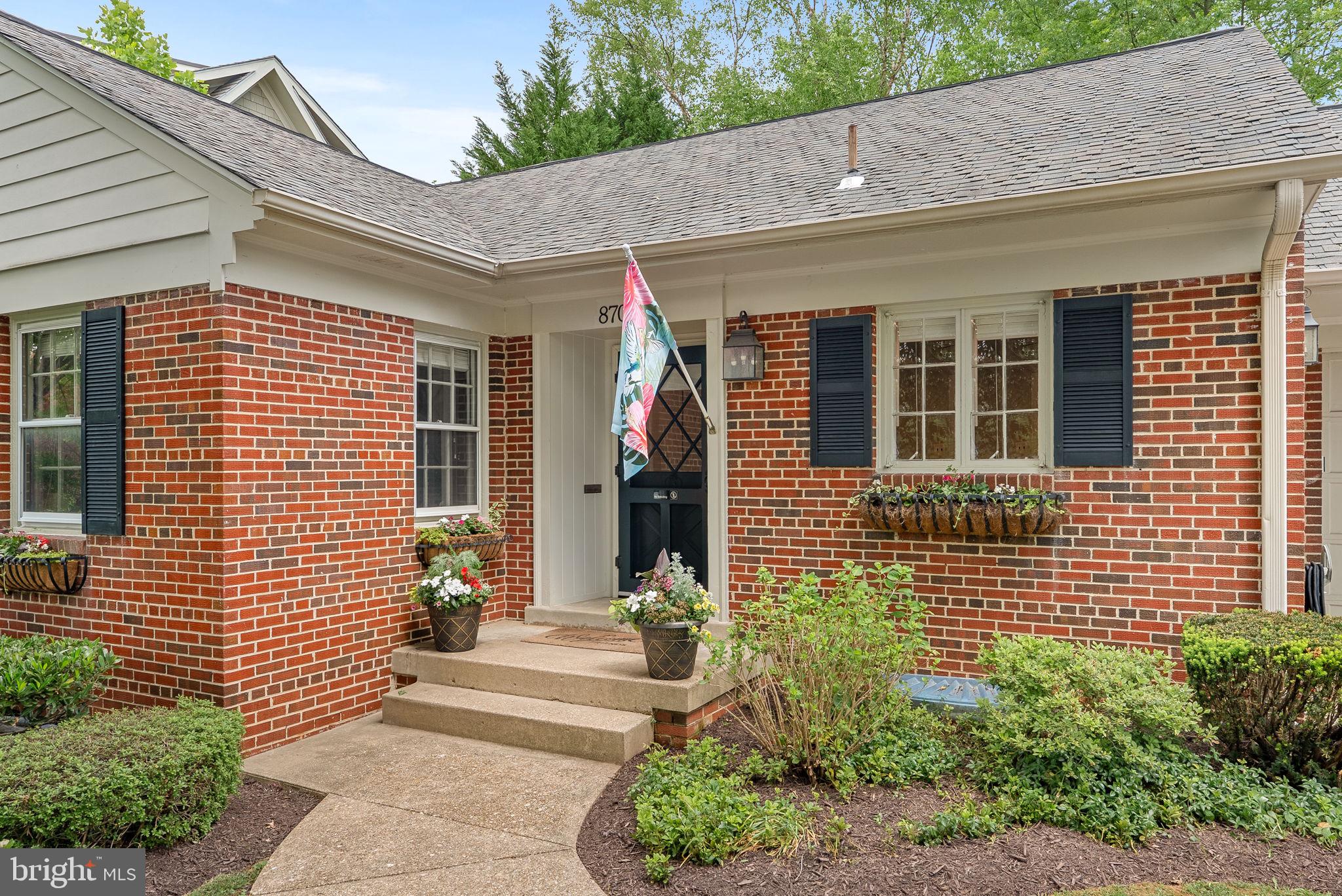 8707 Ridge Road Bethesda, MD 20817 - Photo 65 of 70 front view of a brick house with a large windows