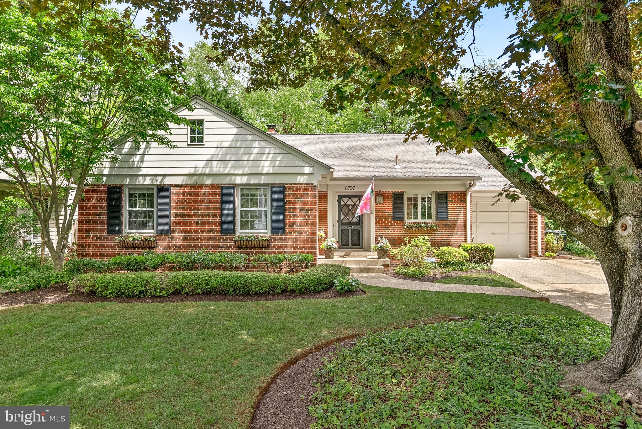 8707 Ridge Road Bethesda, MD 20817 - Photo 69 of 70 a front view of a house with a yard and porch