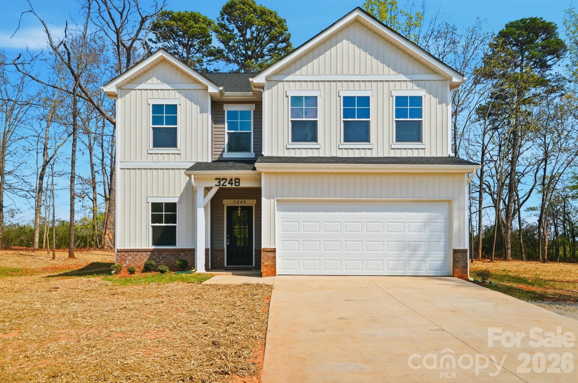 3248 Killian Road Lincolnton, NC 28092 - Photo 1 of 44 a front view of a house with a yard and garage