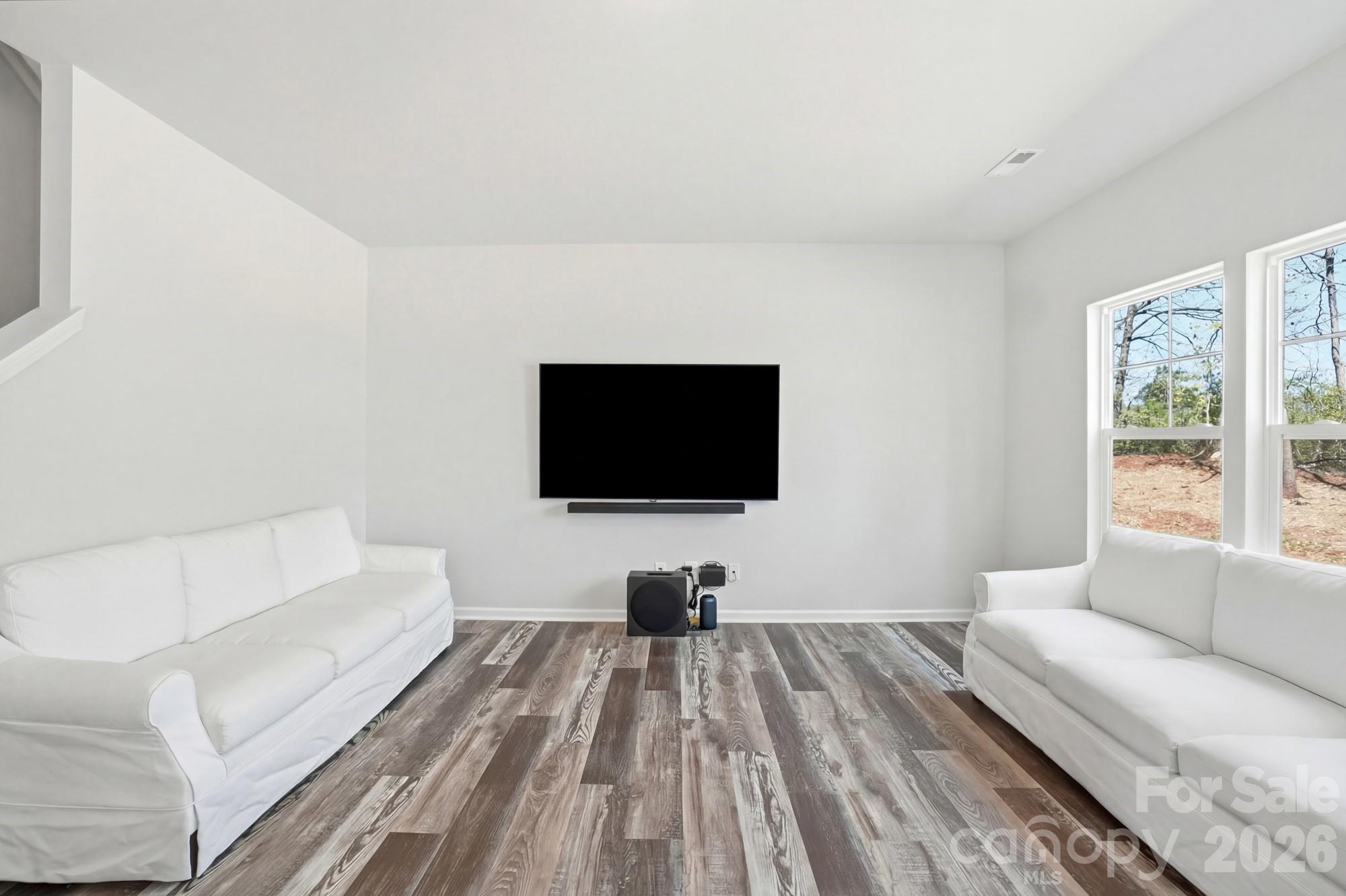 3248 Killian Road Lincolnton, NC 28092 - Photo 12 of 44 a living room with a flat screen tv a couch and a window