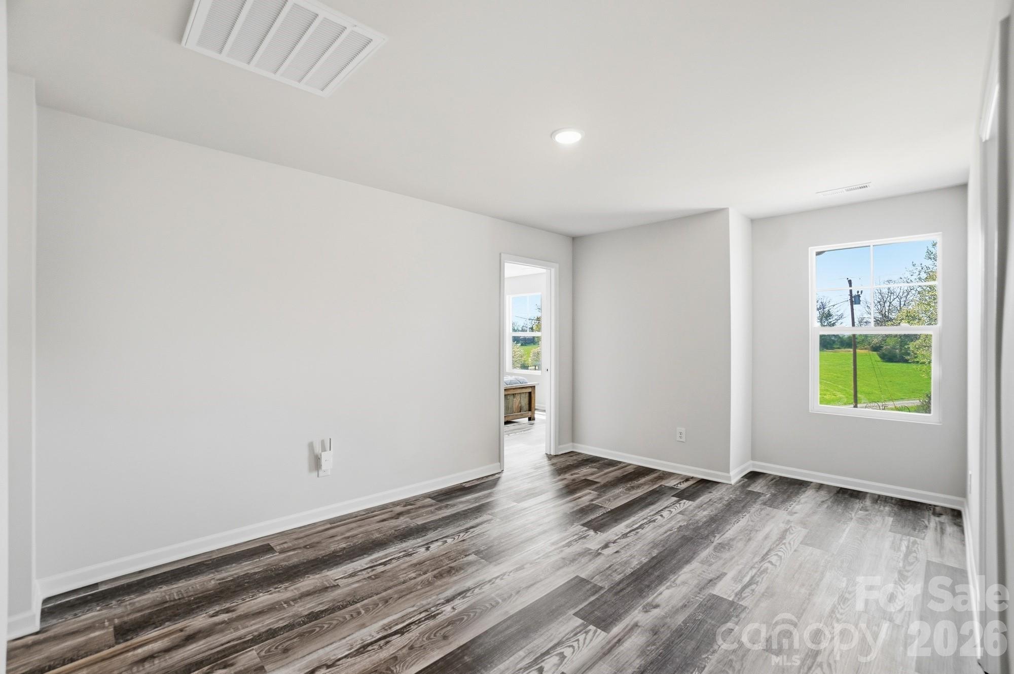 3248 Killian Road Lincolnton, NC 28092 - Photo 23 of 44 wooden floor in an empty room with a window