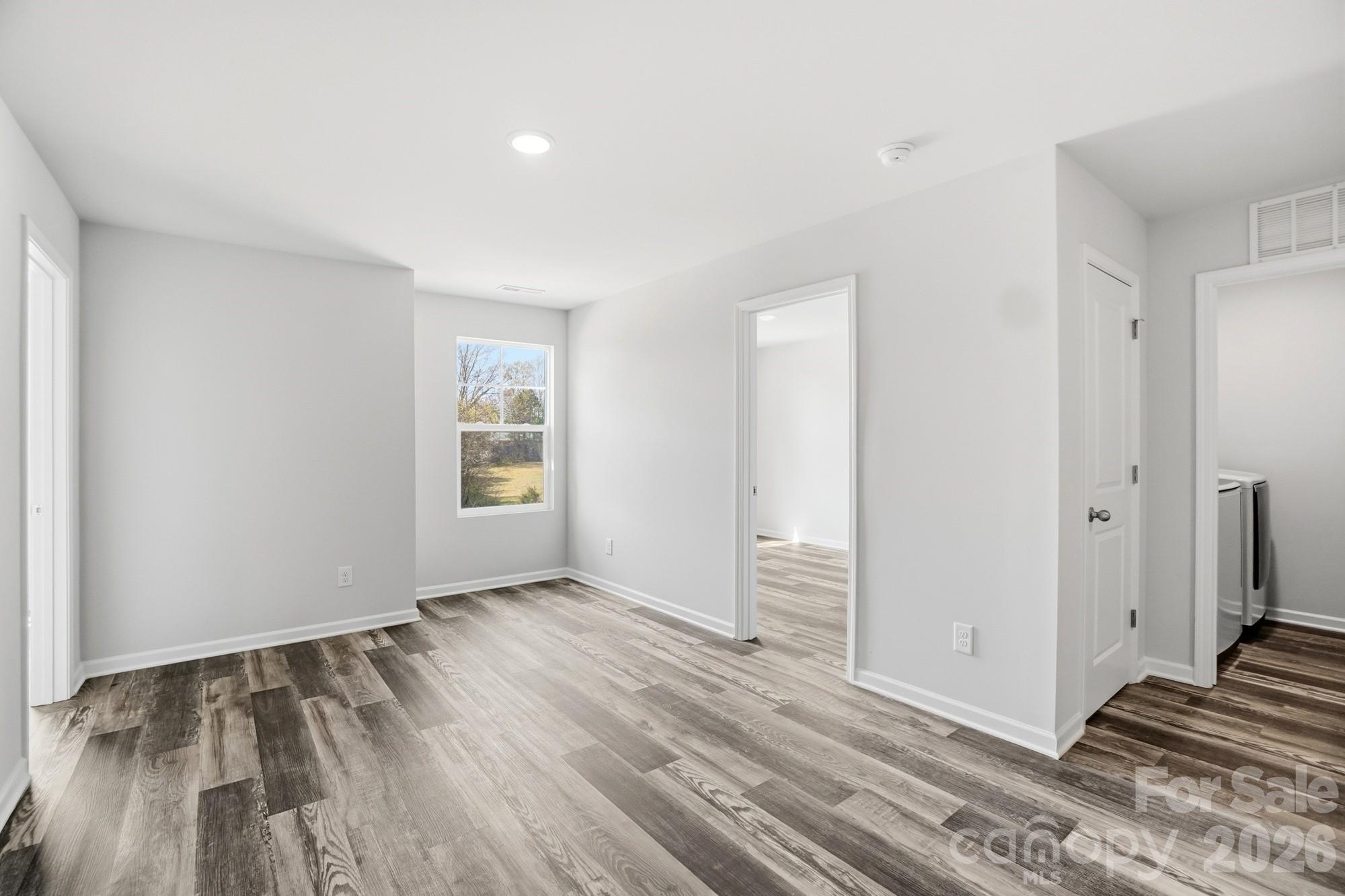 3248 Killian Road Lincolnton, NC 28092 - Photo 24 of 44 an empty room with wooden floor and windows