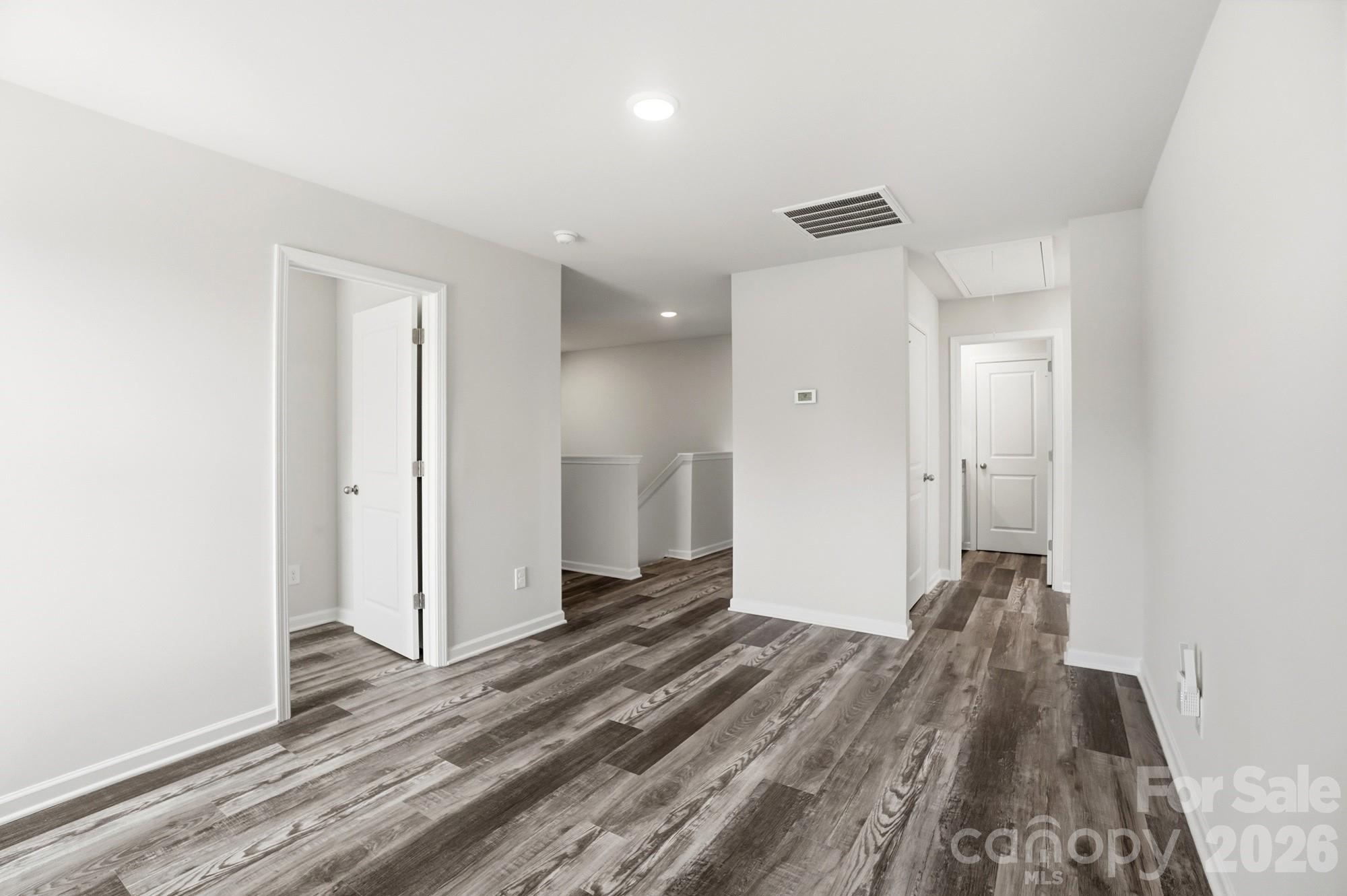 3248 Killian Road Lincolnton, NC 28092 - Photo 25 of 44 a view of a room with wooden floor and a ceiling fan