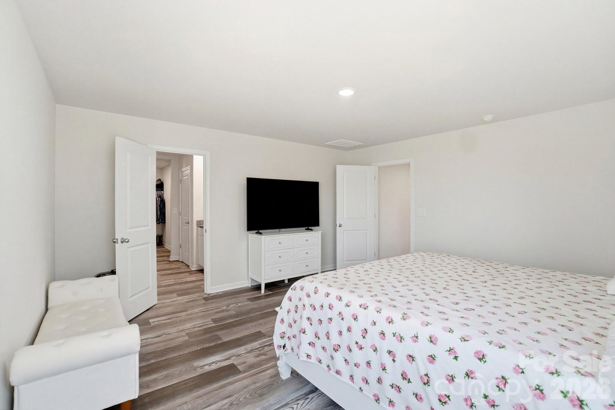 3248 Killian Road Lincolnton, NC 28092 - Photo 28 of 44 a bedroom with a bed and a flat screen tv