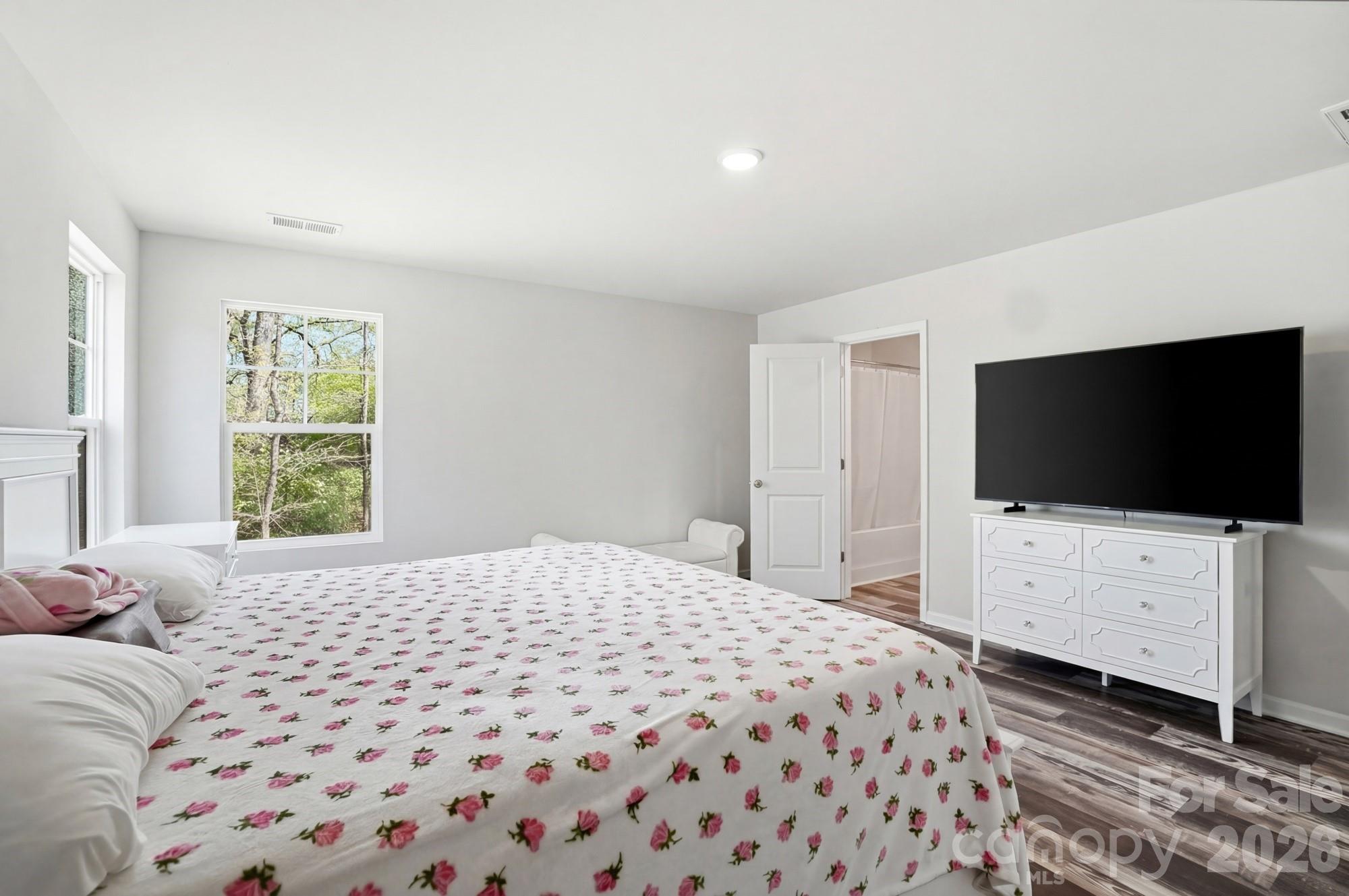 3248 Killian Road Lincolnton, NC 28092 - Photo 29 of 44 a bedroom with a bed and a flat screen tv