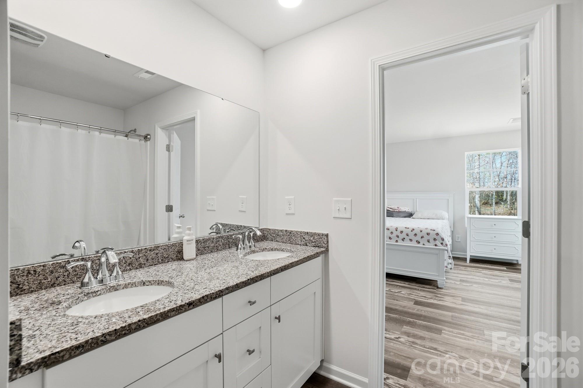3248 Killian Road Lincolnton, NC 28092 - Photo 30 of 44 a en suite bathroom with double sink and a mirror