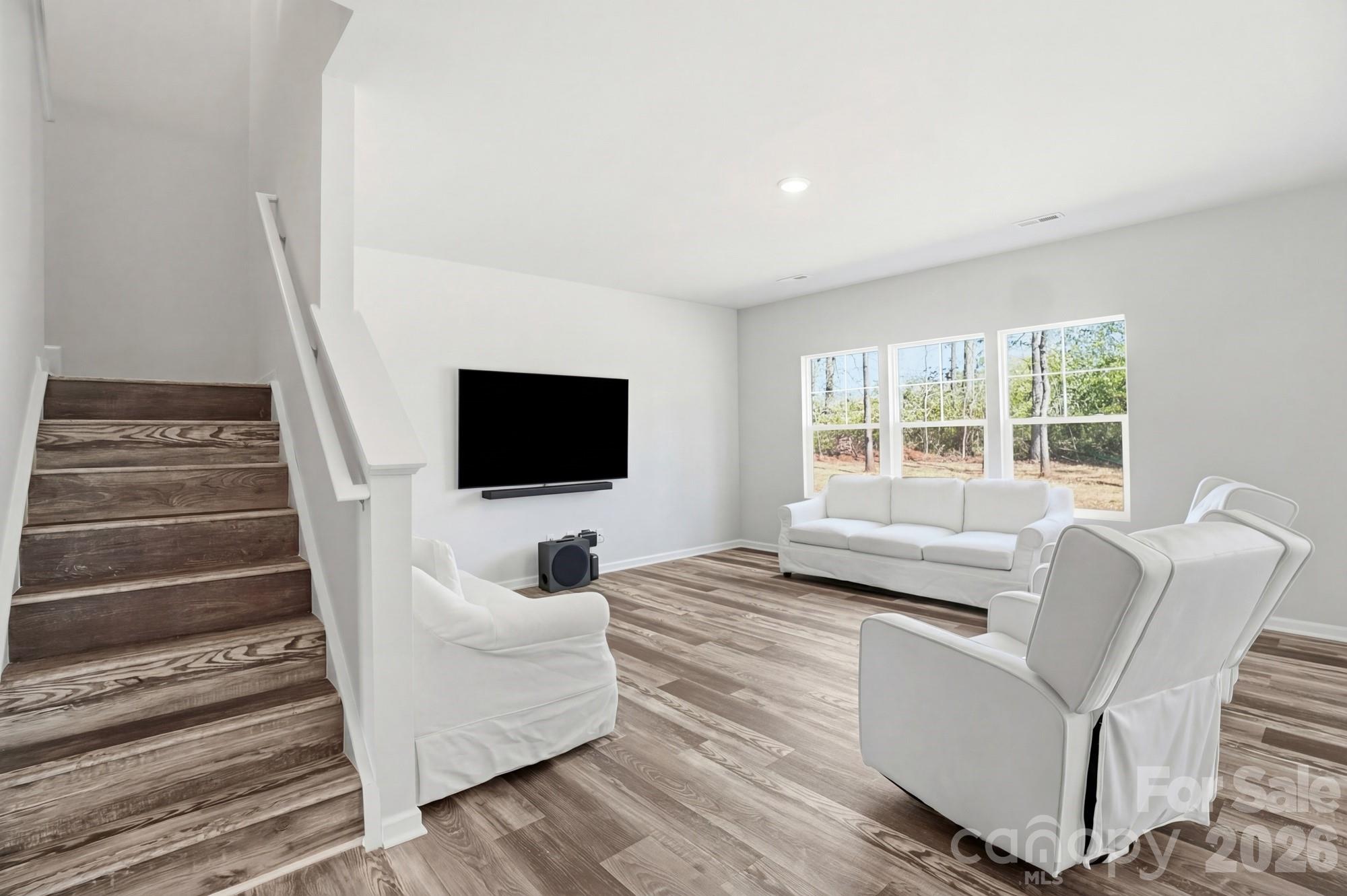 3248 Killian Road Lincolnton, NC 28092 - Photo 8 of 44 a living room with furniture and a flat screen tv