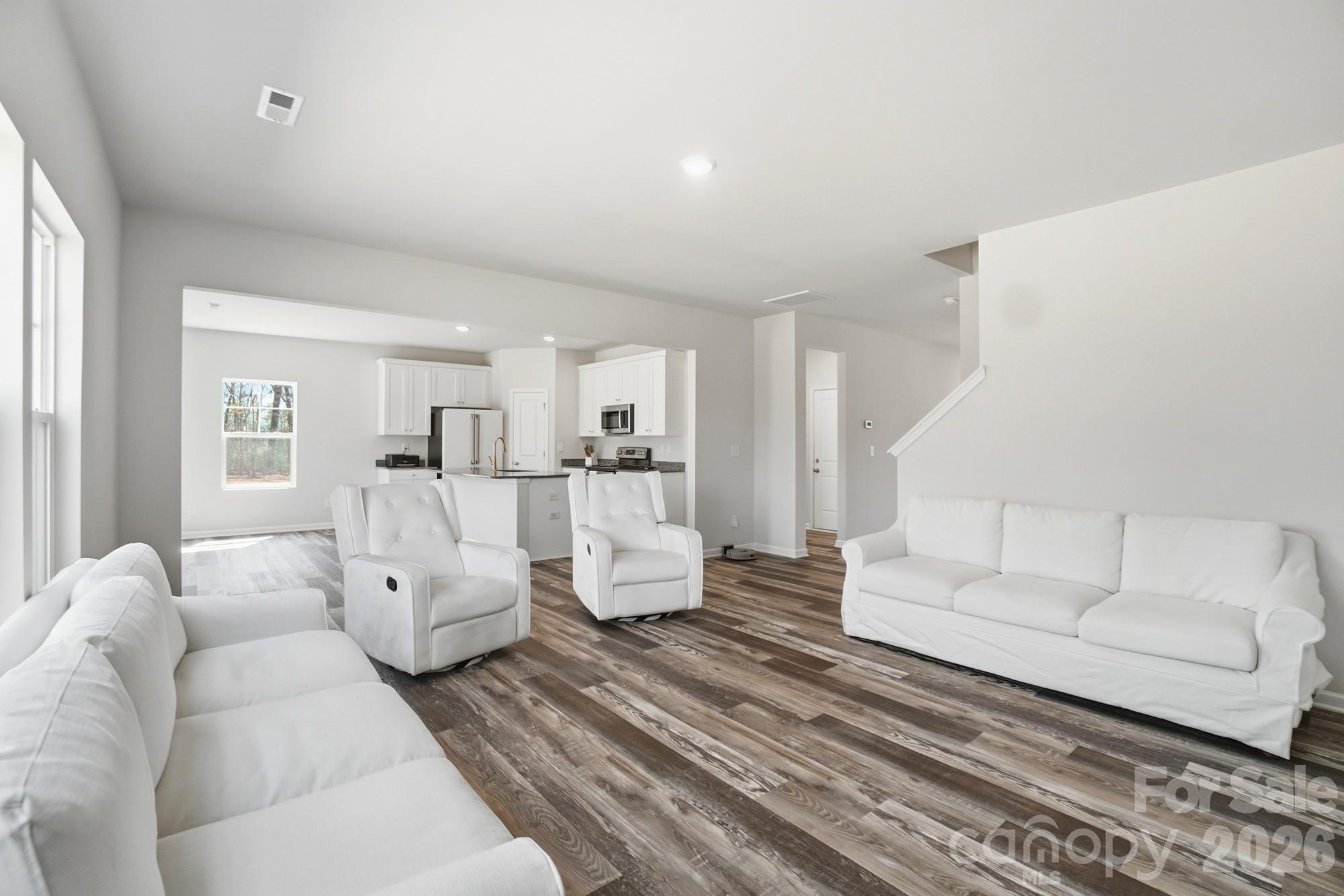 3248 Killian Road Lincolnton, NC 28092 - Photo 10 of 44 a living room with furniture and white walls