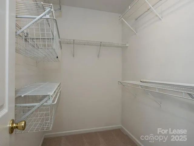 a view of a room with racks on the wall