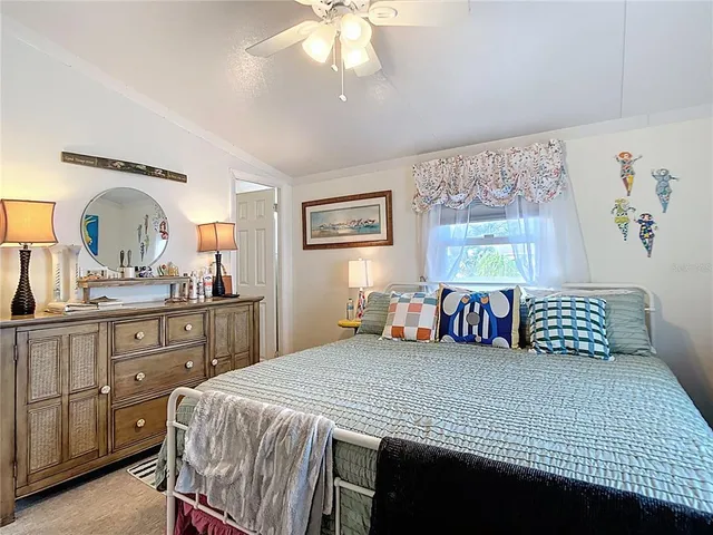 a bedroom with a bed and cabinets