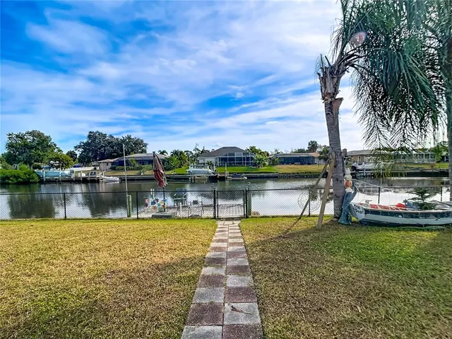 a buildings covered with tall trees