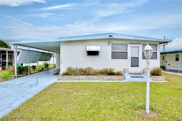 a front view of house with yard