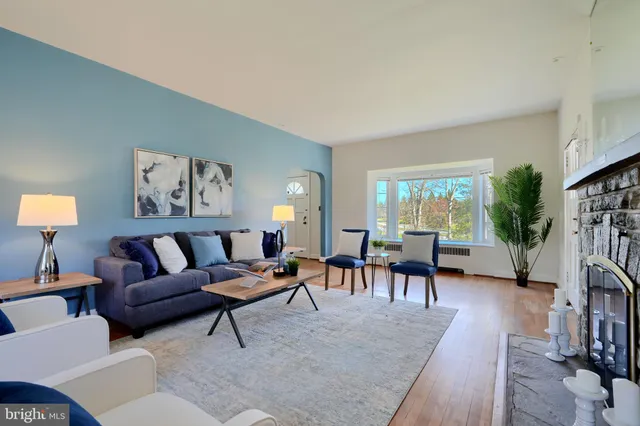 a kitchen that has a lot of cabinets in it and wooden floor