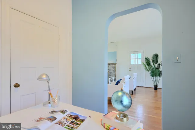 a bathroom with a sink mirror and toilet
