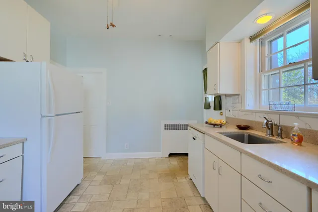 a bathroom with a sink a mirror and vanity