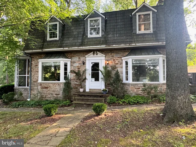 a view of hallway with wooden floor and staircase